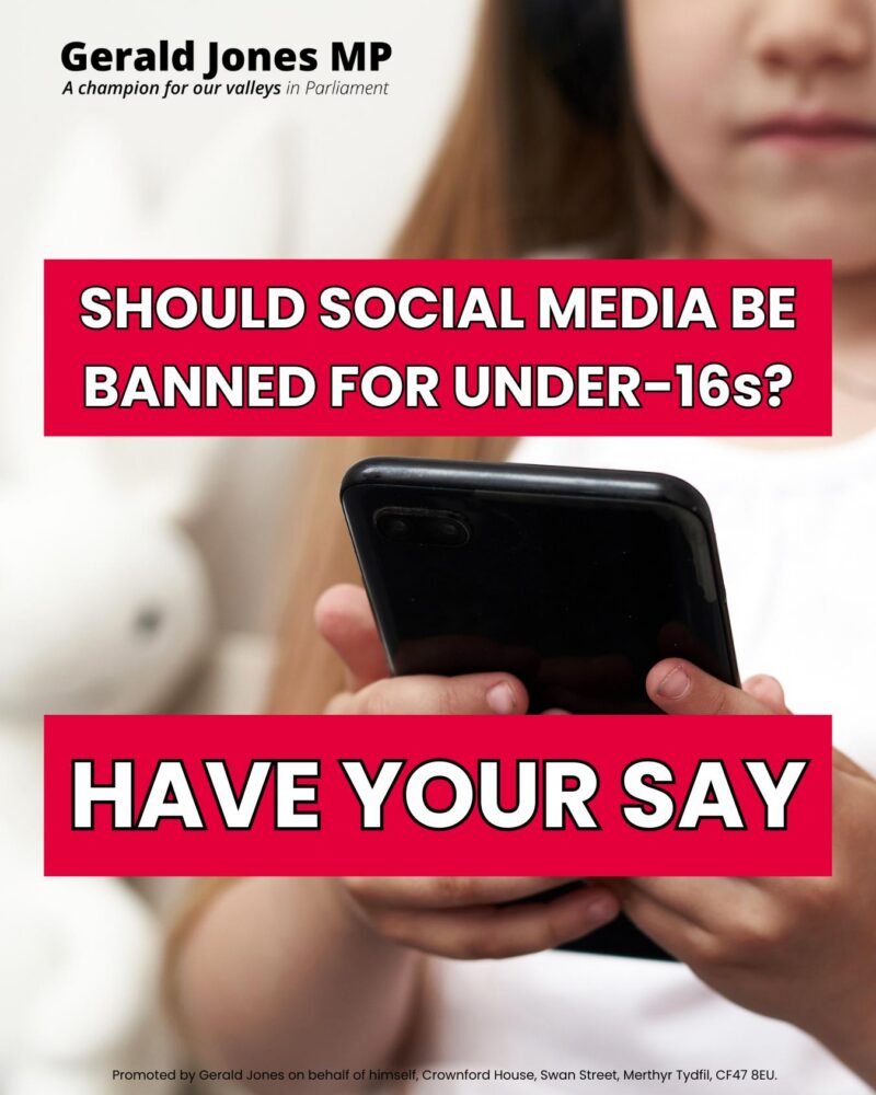 Image of a child holding a mobile phone.