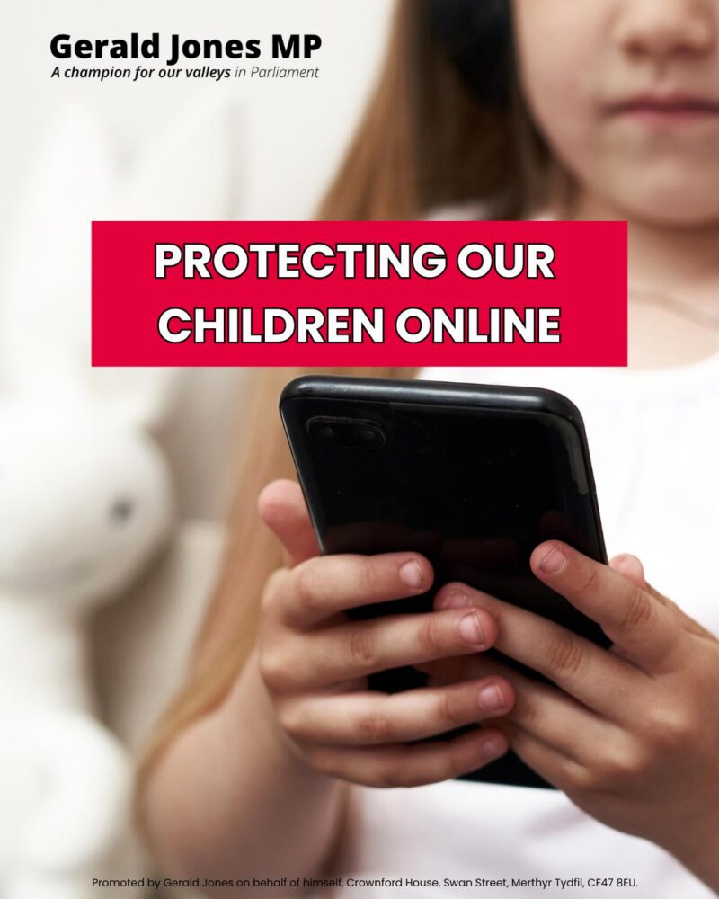 Image of a child holding a mobile phone.